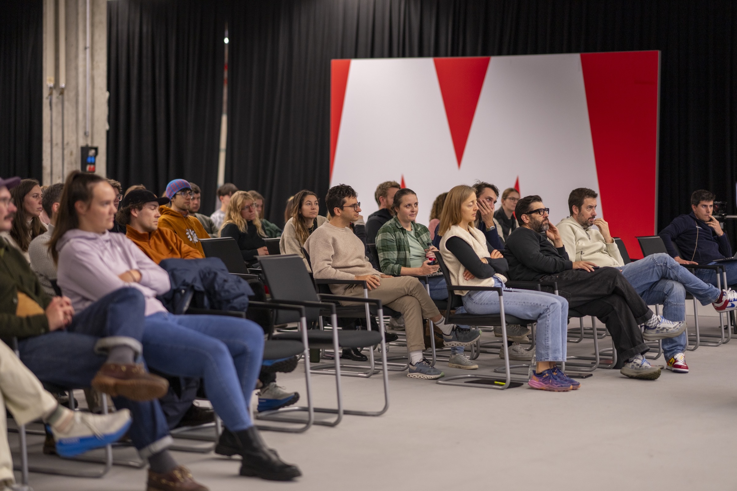 Engaged audience listening to Greg Nieuwenhuys